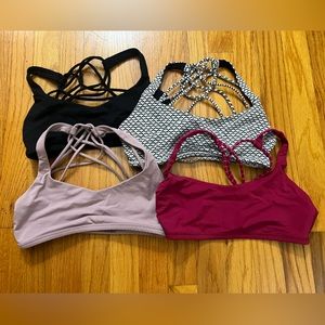 Lot of Four (4) Lululemon Size 4 (small) Sports Bras in various colors.